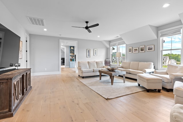 living area featuring recessed lighting, visible vents, light wood-style flooring, ceiling fan, and baseboards