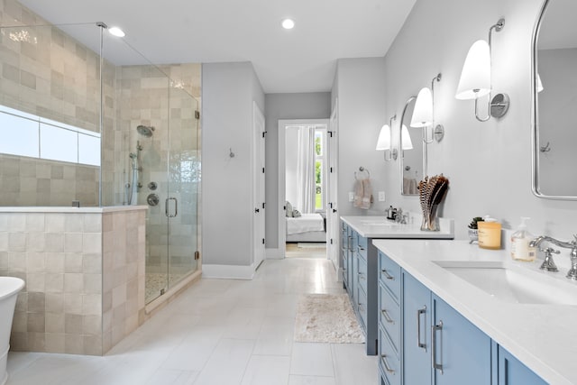 ensuite bathroom with plenty of natural light, ensuite bath, vanity, and a shower stall