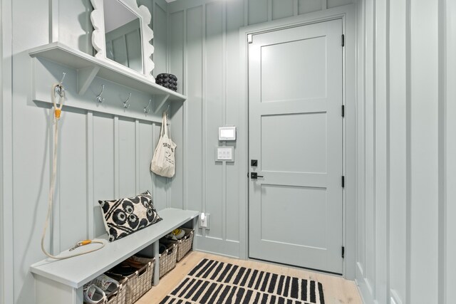 mudroom with light wood finished floors