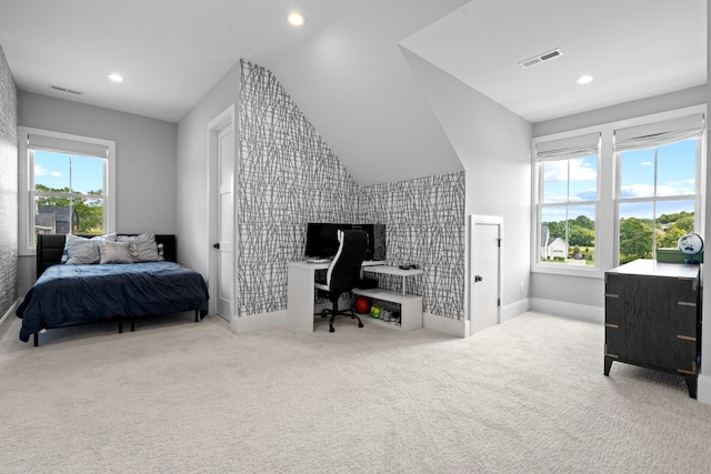 carpeted bedroom featuring lofted ceiling, baseboards, visible vents, and recessed lighting