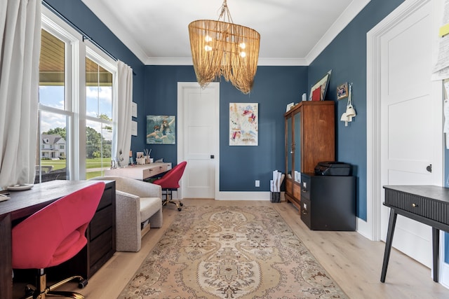 office area with a chandelier, light wood-type flooring, crown molding, and baseboards