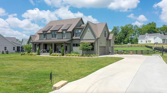 5124 Bond Mill Rd, Thompsons Station, TN 37179 - view of front facade featuring board and batten siding, a porch, a standing seam roof, driveway, and metal roof