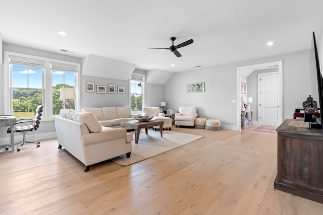 living area with baseboards, light wood-type flooring, a ceiling fan, and recessed lighting