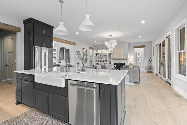 5124 Bond Mill Rd, Thompsons Station, TN 37179 - kitchen with appliances with stainless steel finishes, a sink, recessed lighting, light wood-style floors, and open floor plan