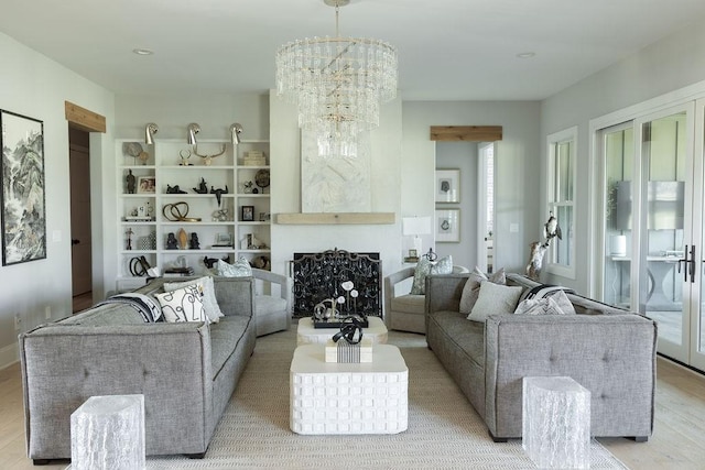 5124 Bond Mill Rd, Thompsons Station, TN 37179 - living room with light wood finished floors, a fireplace, and a chandelier