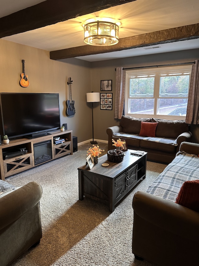 living room with carpet floors and beamed ceiling