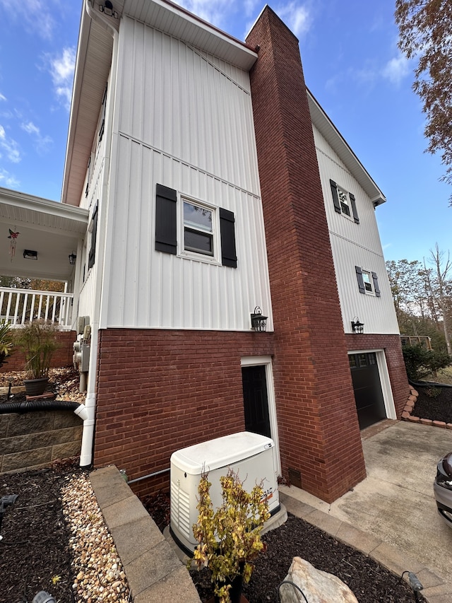 view of side of property featuring a garage