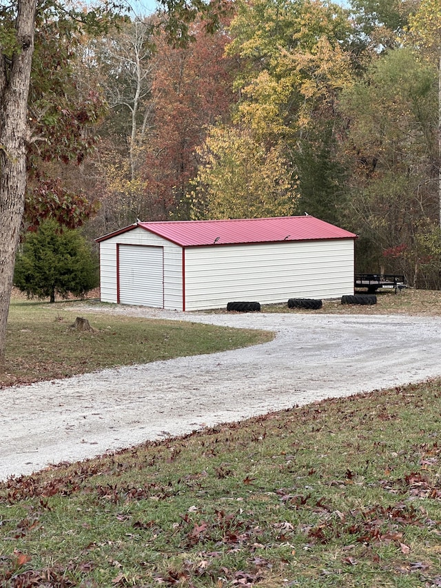 garage featuring a yard