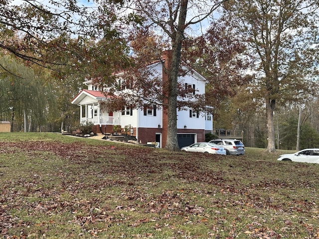 view of front of home featuring a garage and a porch