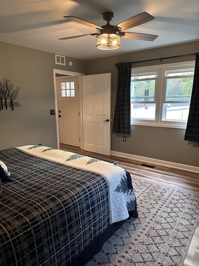 bedroom featuring hardwood / wood-style floors and ceiling fan