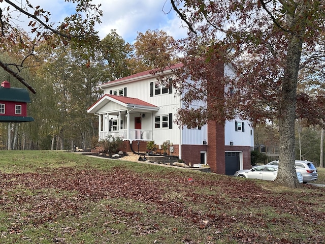 view of front of home featuring a porch and a garage