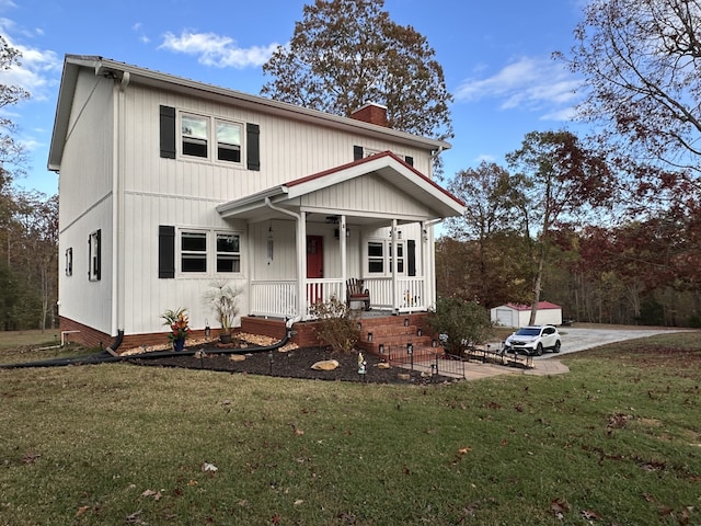 view of property with a porch and a front lawn