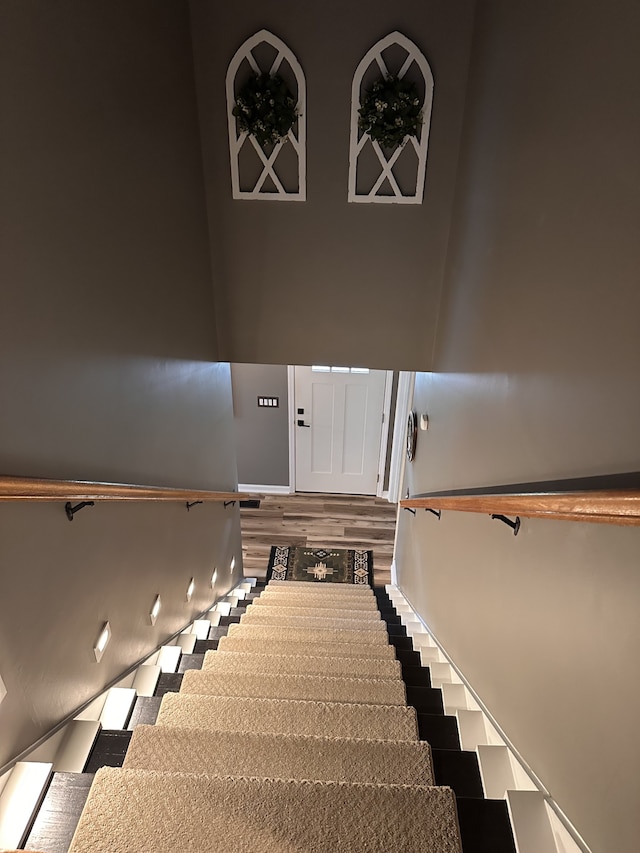 staircase featuring hardwood / wood-style floors