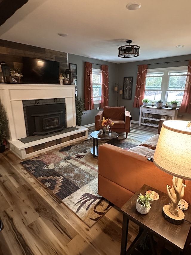 living room with hardwood / wood-style floors and a fireplace