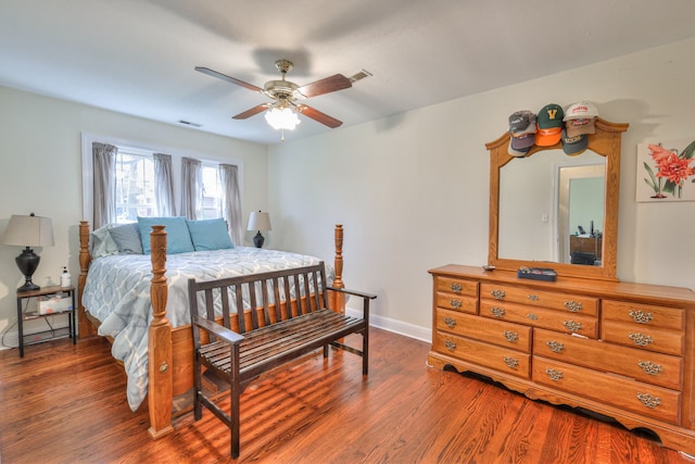 bedroom featuring dark hardwood / wood-style flooring and ceiling fan