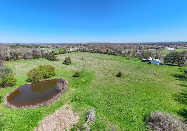 aerial view with a water view and a rural view