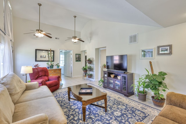 tiled living room with high vaulted ceiling and ceiling fan