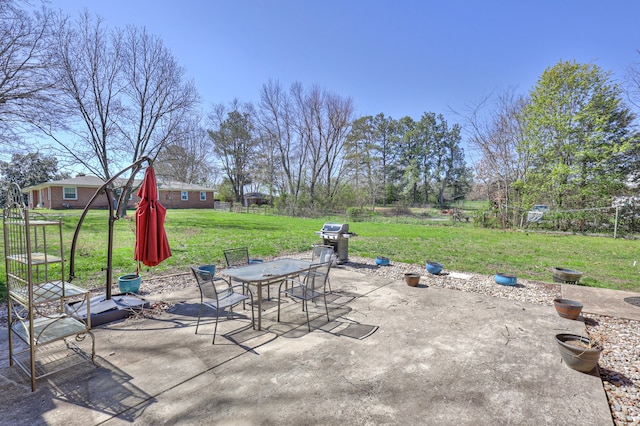 view of patio featuring a grill