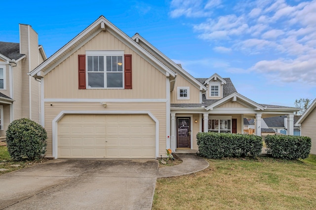 view of front of house with a garage and a front yard