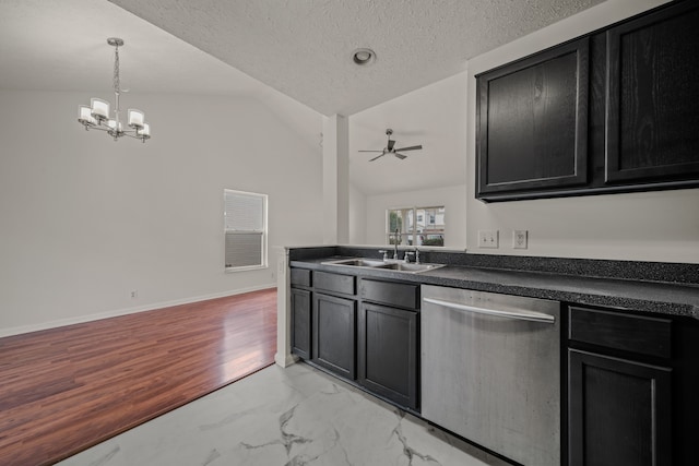 kitchen with sink, ceiling fan with notable chandelier, light hardwood / wood-style flooring, dishwasher, and vaulted ceiling