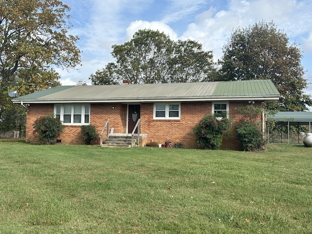 single story home featuring a front lawn and a carport