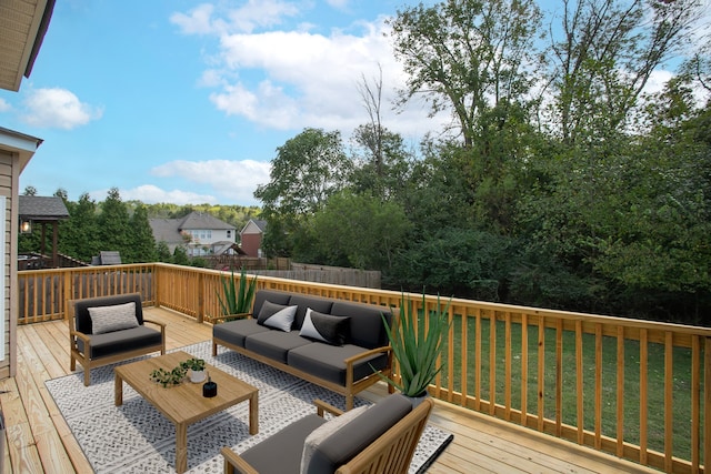 wooden terrace with a lawn and an outdoor hangout area