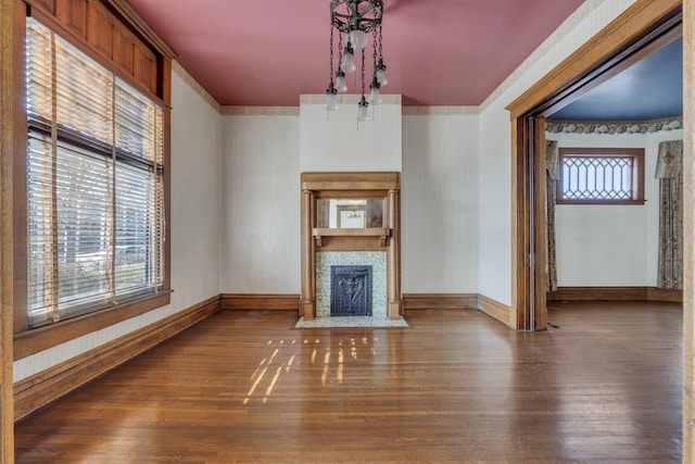 unfurnished living room featuring wood-type flooring