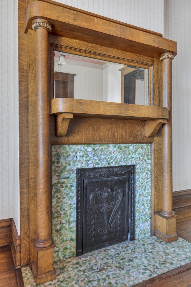 details with a tile fireplace