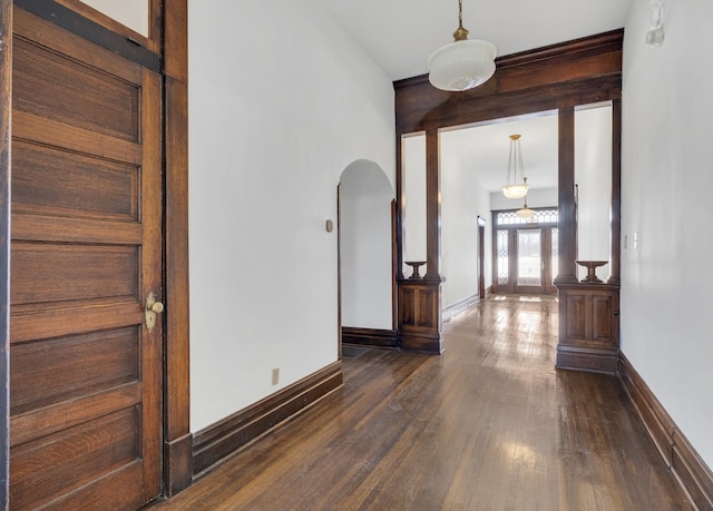 hallway with dark wood-type flooring and french doors