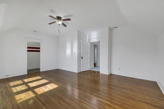 spare room with dark hardwood / wood-style flooring and ceiling fan