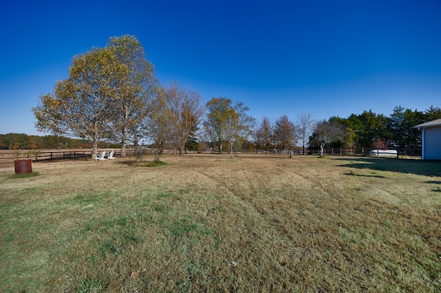 view of yard with a rural view