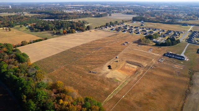 birds eye view of property featuring a rural view