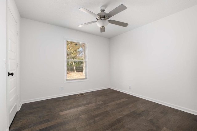 unfurnished room featuring ceiling fan and dark hardwood / wood-style flooring