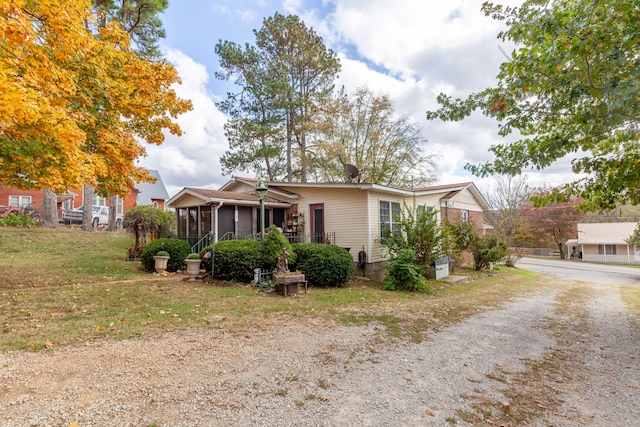 view of front of property featuring a sunroom