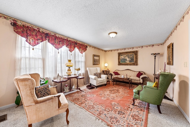 living room featuring carpet floors and a textured ceiling