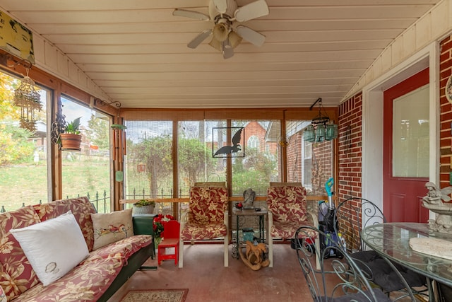 sunroom / solarium featuring ceiling fan