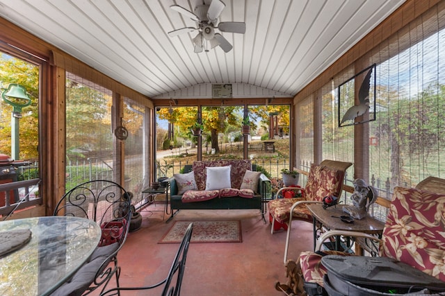 sunroom / solarium featuring ceiling fan and vaulted ceiling