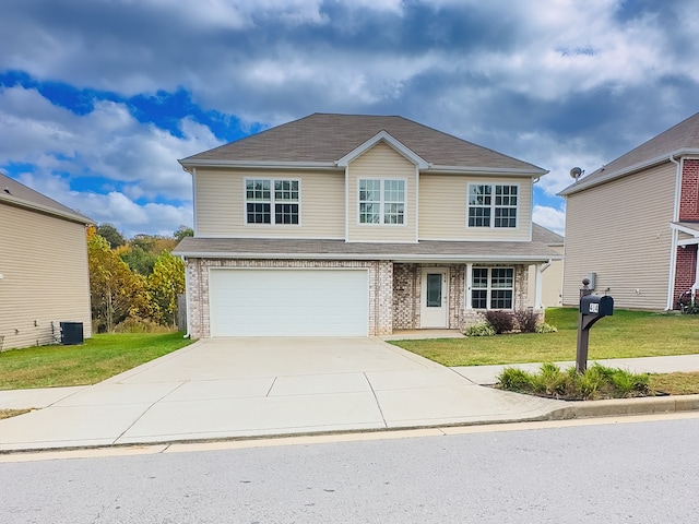 front of property featuring a garage and a front yard