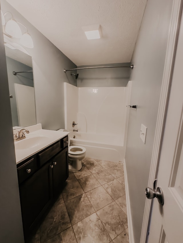 full bathroom with bathing tub / shower combination, vanity, a textured ceiling, and toilet