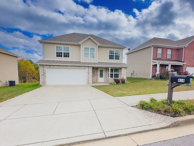 view of front of property with a garage and a front lawn