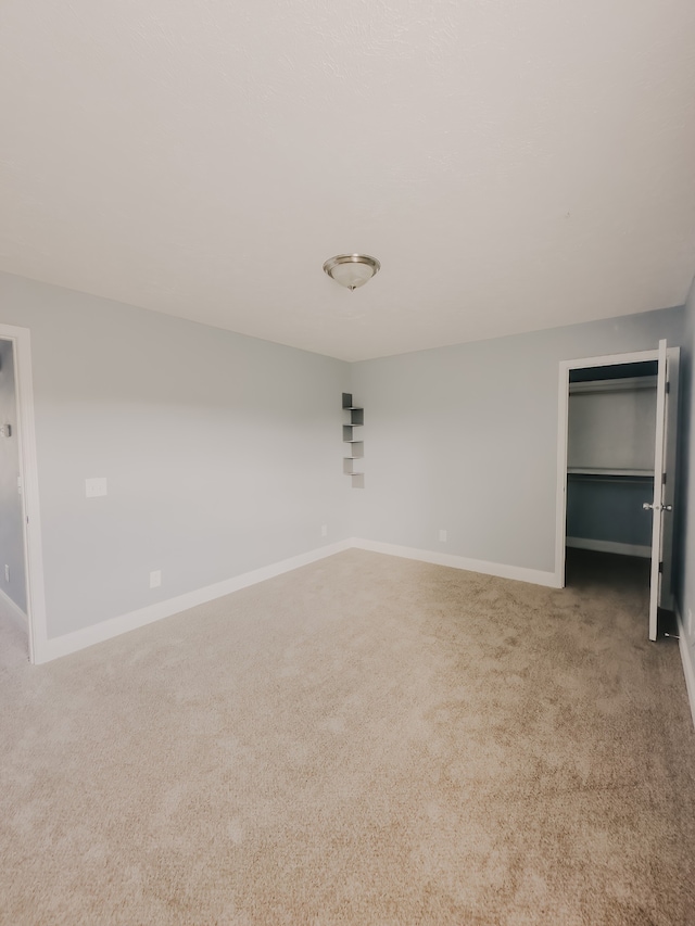 unfurnished bedroom featuring light colored carpet