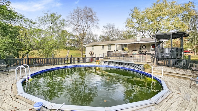 view of swimming pool featuring a deck