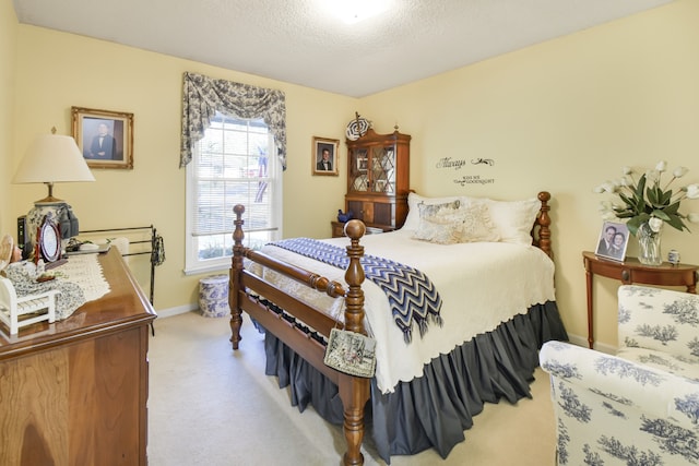 carpeted bedroom with a textured ceiling