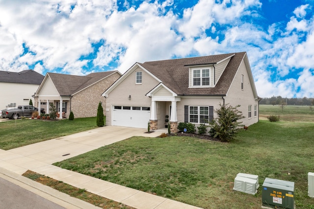 view of front of house with a garage and a front lawn