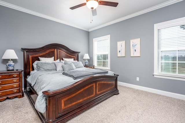 bedroom featuring ceiling fan, light carpet, and ornamental molding