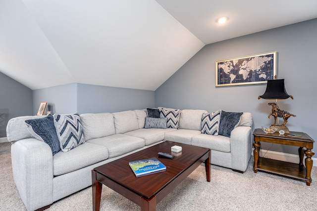 living room with vaulted ceiling and light carpet