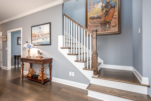 stairs with wood-type flooring and crown molding