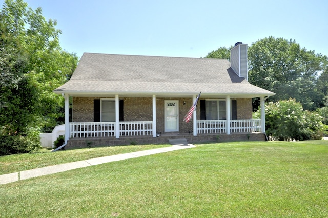 view of front facade with a porch and a front lawn