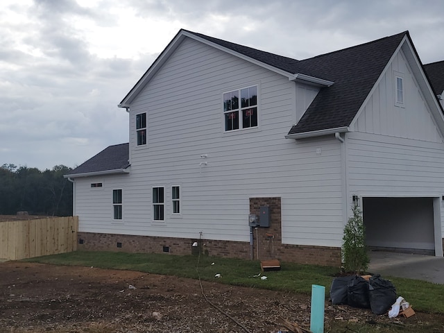 view of side of home with a garage