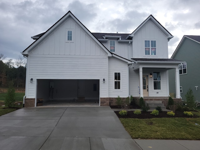 view of front of property with a garage and a porch